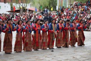 Women Folk Dancers performing tradition dance at Paro Tshechu festival in Bhutan