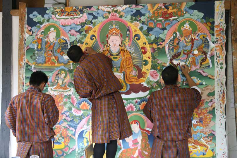Traditional artists painting Guru Padmasambava.