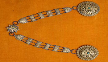 A pair of brooch used by Bhutanese women as an ornament. 