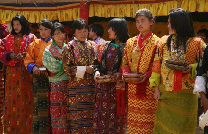 Women wearing traditional Bhutan dress called Kira during an annual festival in one of the remote villages in Bhutan